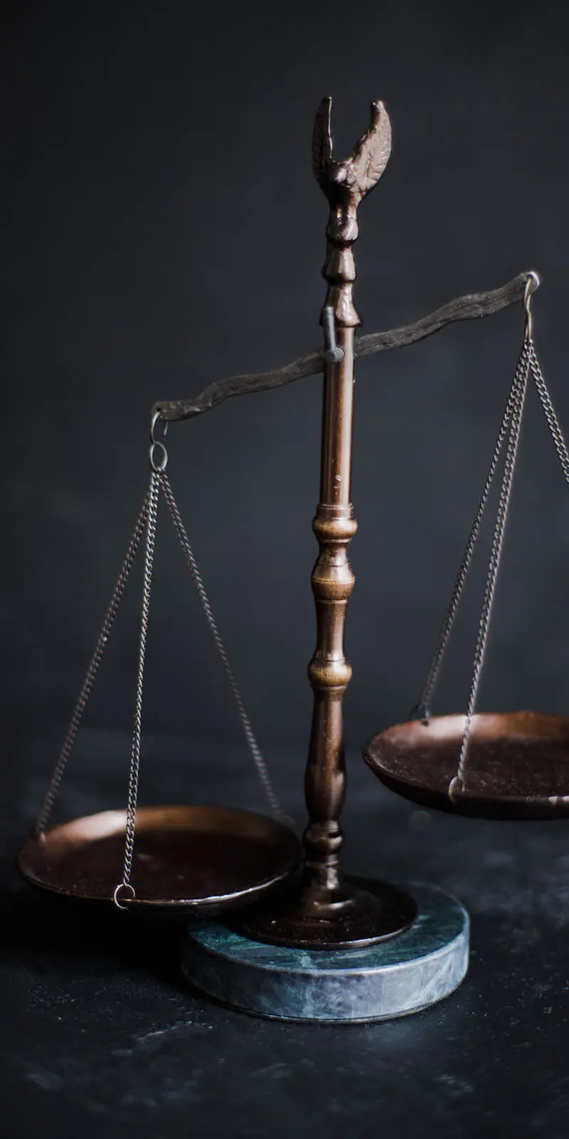 Bronze scales of justice — licensed Louisiana bail bondsman taking emergency calls 24/7